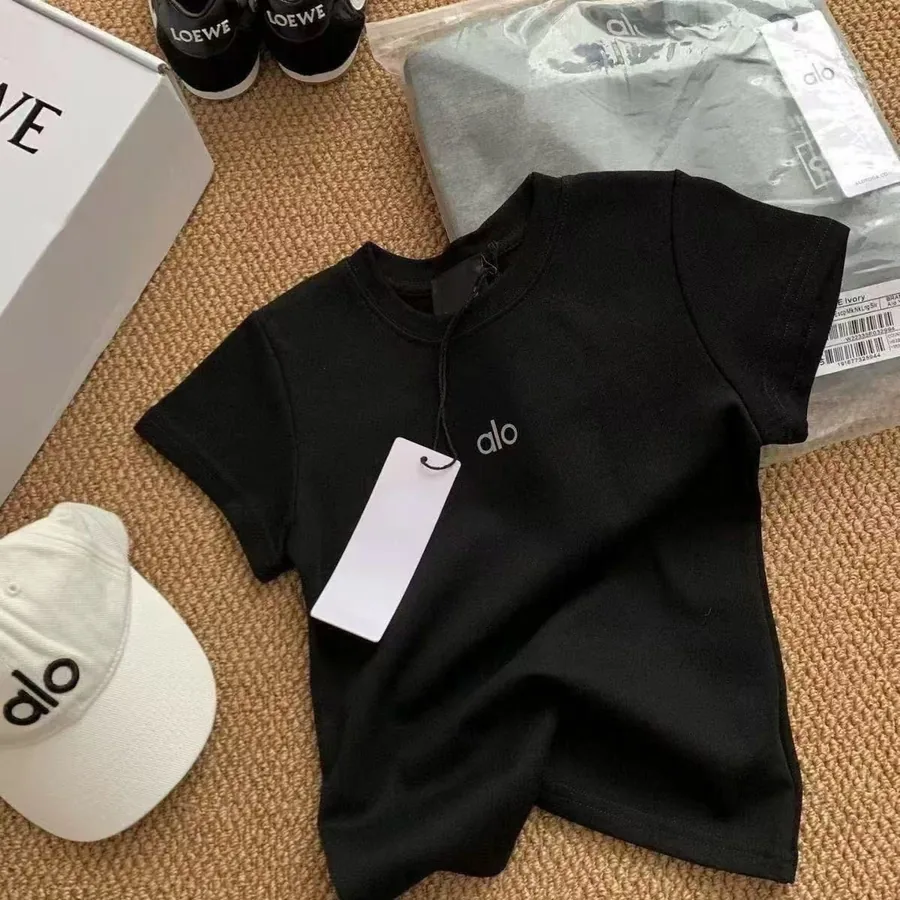 Blue casual top arranged with trainers, packaging and accessories
