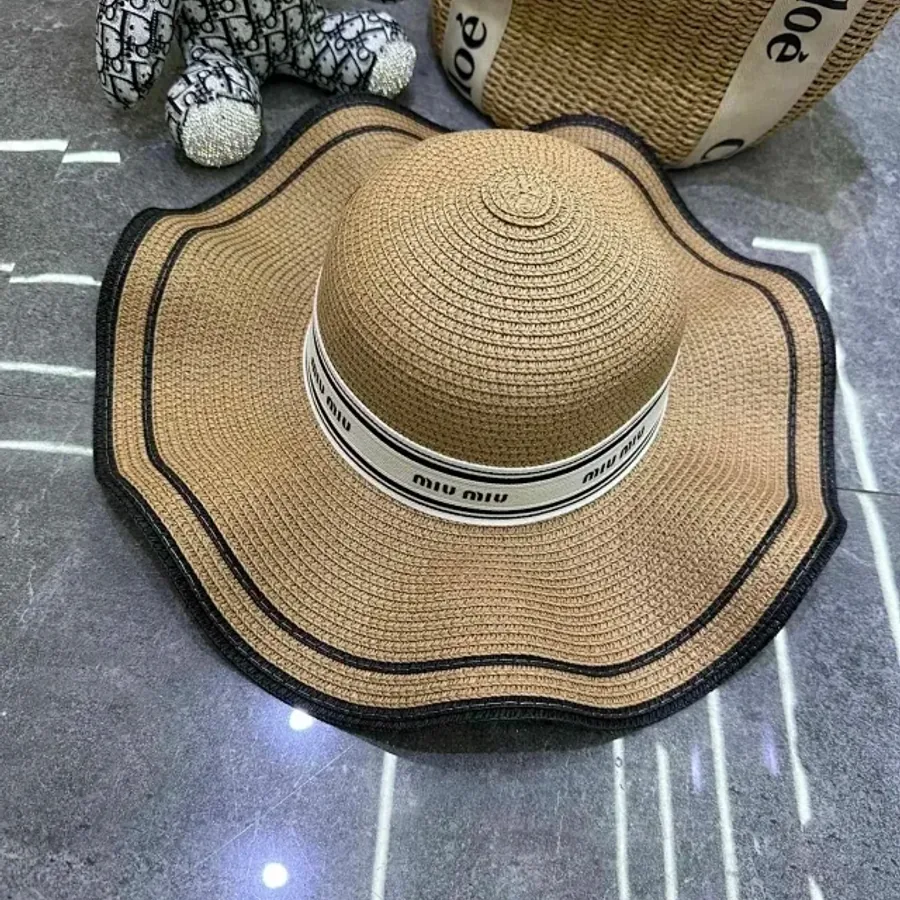 Warm brown woven sun hat photographed as an accessory reference